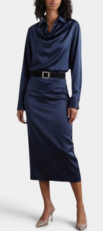 Mahaute Macarena navy blue satin midi dress with a draped shirt collar, long sleeves, and a square buckle belt.