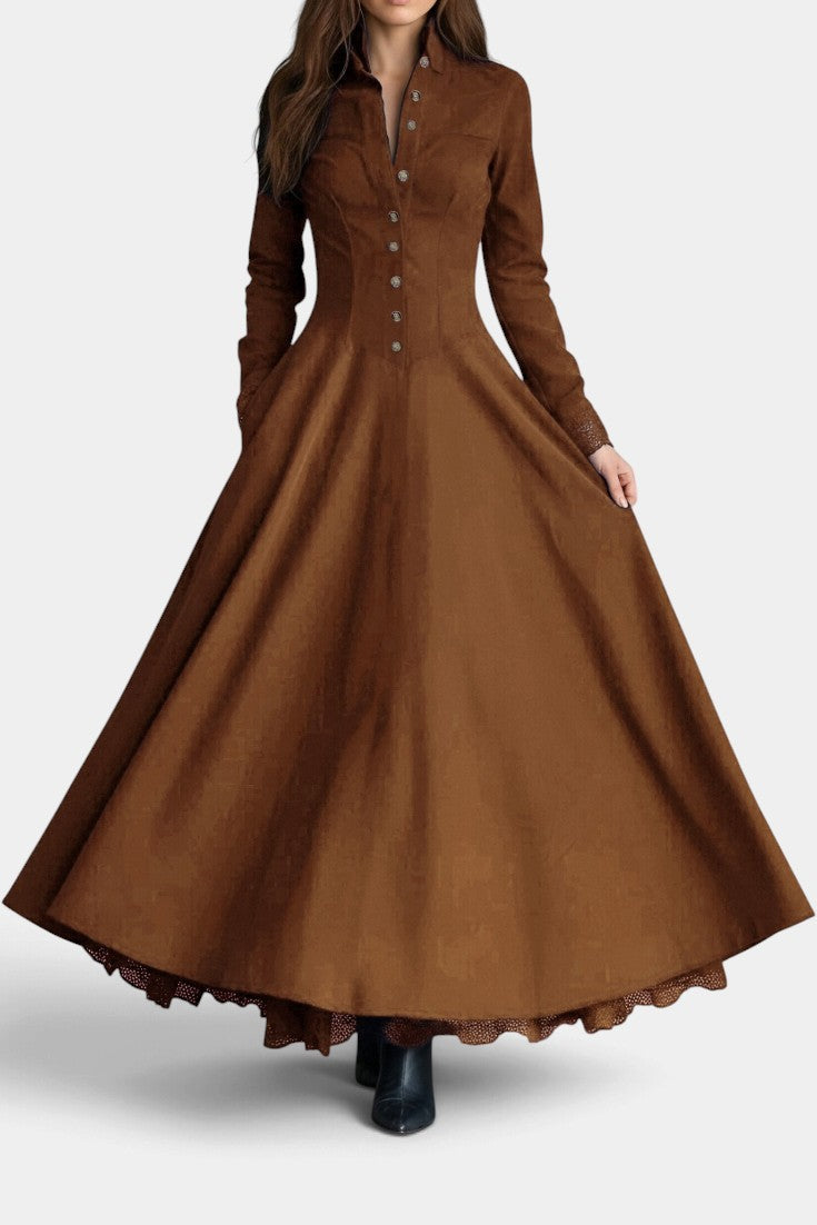 Mahaute Maravilla long brown faux suede shirt dress with a fitted waist, button-down front, and flared skirt.