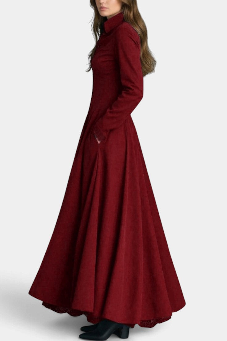 Mahaute Maravilla long burgundy faux suede shirt dress with a cinched waist and flared skirt worn by a model
