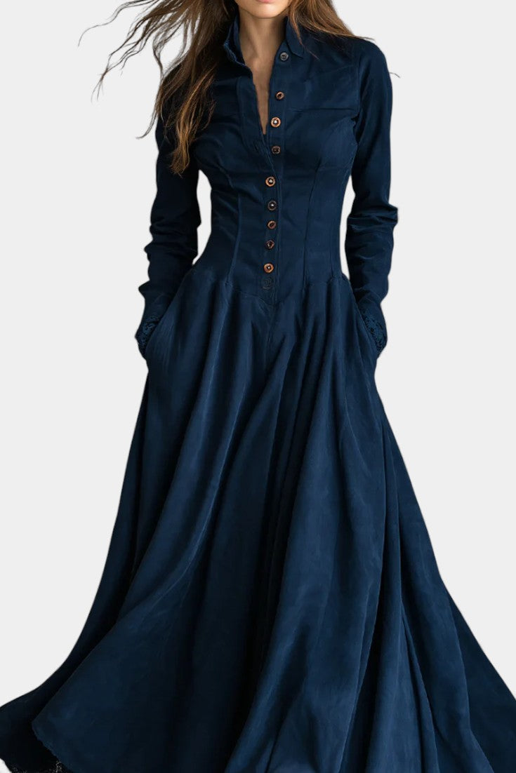 Mahaute Maravilla long navy blue faux suede shirt dress with a structured collar, button-down front, and flared skirt.