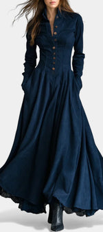 Mahaute Maravilla long navy blue faux suede shirt dress with a fitted waist, button-down front, and flared skirt.