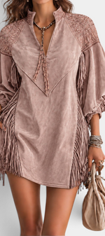 Mahaute short bohemian dress in mauve faux suede with fringe details, beaded shoulders, and voluminous sleeves.
