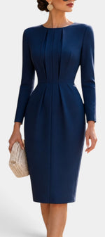 Mahaute navy blue midi dress with structured front pleats, long sleeves, and a fitted silhouette for formal events.