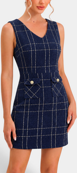Mahaute navy blue tweed-effect short dress with white grid pattern, V-neck, and decorative gold button pockets.