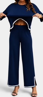 Mahaute Ysella navy blue knit lounge set with white contrast trim on the loose top and wide-leg trousers with slits.