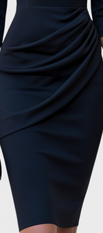 Mahaute Nefeli black midi sheath dress with asymmetric neckline and draped waist detail held with a gold clutch