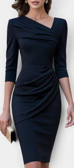 Mahaute Nefeli navy blue midi sheath dress with asymmetrical neckline, draped bodice, and three-quarter sleeves.