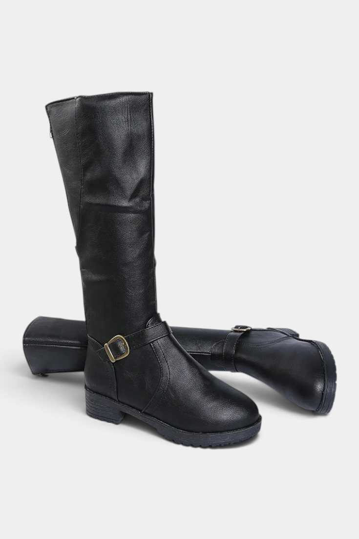 Mahaute Nevena black faux leather knee-high boots featuring a buckled ankle strap and a sturdy lug sole.