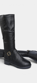Mahaute Nevena black faux leather knee-high boots featuring a buckled ankle strap and a sturdy lug sole.