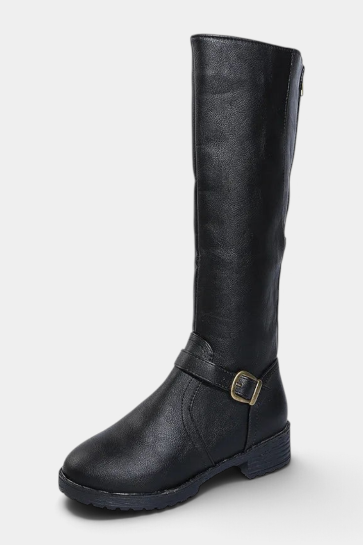 Mahaute Nevena black faux leather knee-high boots with a buckled ankle strap and chunky lug sole