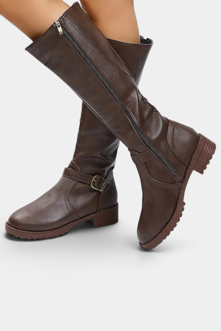 Mahaute Nevena brown faux leather knee-high boots with buckle strap, back zipper, and chunky lug sole