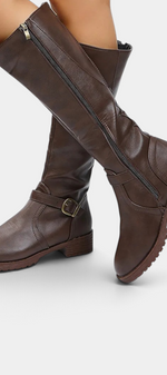 Mahaute Nevena brown faux leather knee-high boots with buckle strap, back zipper, and chunky lug sole