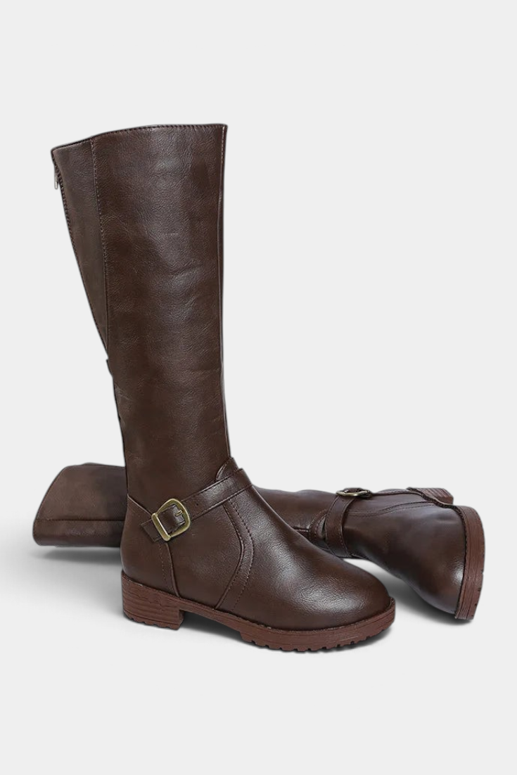 Mahaute Nevena brown faux leather high boots with a buckled ankle strap and a sturdy lug sole for daily wear.
