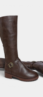 Mahaute Nevena brown faux leather high boots with a buckled ankle strap and a sturdy lug sole for daily wear.