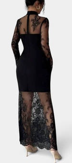 Mahaute Nicolina black long fitted dress with high neck, long sleeves, and intricate floral lace transparent panels.