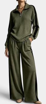 Mahaute olive green ribbed knit lounge set with zip-up sweater and wide-leg trousers featuring black side stripes.