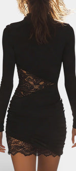 Back view of Mahaute Oona black fitted mini dress with long sleeves, side lace cutouts, and ruched skirt detailing.
