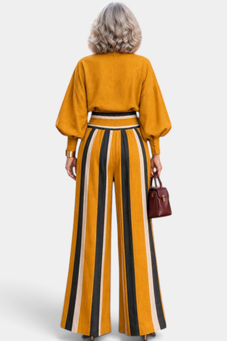 Mahaute Orlianne mustard yellow blouse and wide-leg striped trousers set with puff sleeves, back view.