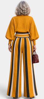 Mahaute Orlianne mustard yellow blouse and wide-leg striped trousers set with puff sleeves, back view.