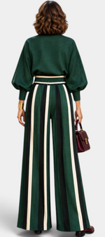 Mahaute Orlianne green blouse with puff sleeves and high-waisted wide-leg trousers featuring vertical stripes.