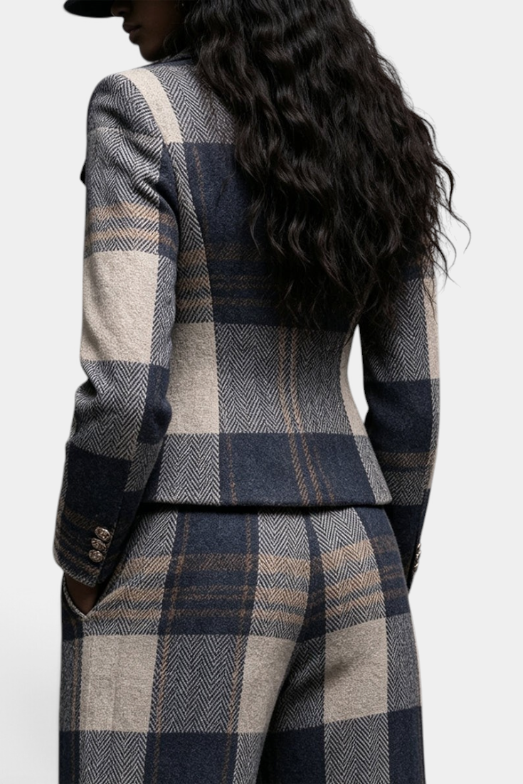 Back view of Mahaute Paca plaid blazer and high-waisted trousers set in navy and beige wool blend.