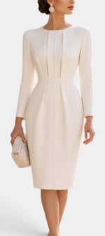 Mahaute cream midi dress with structured pleats, long sleeves, and a fitted waist for a sophisticated ceremony look.