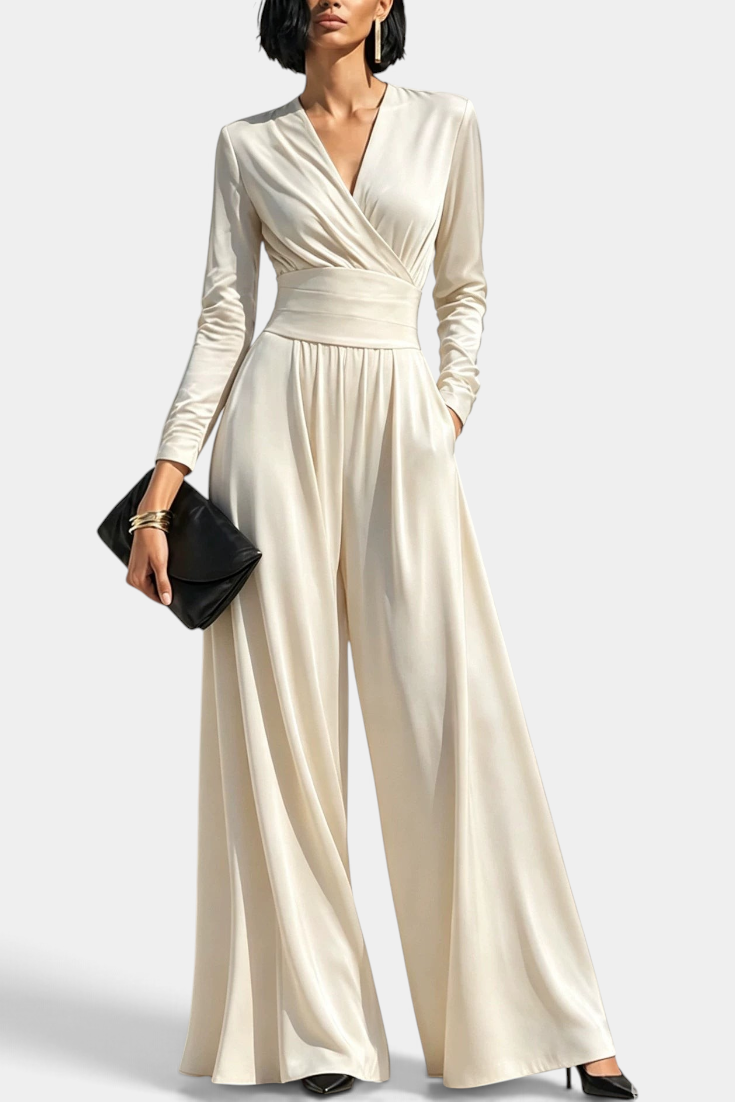 Mahaute Petronella cream satin wrap-front jumpsuit with long sleeves, high waist, and wide-leg trousers.
