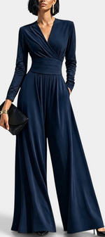 Mahaute Petronella navy blue long-sleeve wrap jumpsuit with a high waist and wide-leg trousers on a model