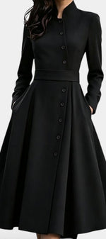 Mahaute Prague black midi dress with a structured high collar, front button closure, and a belted waist.