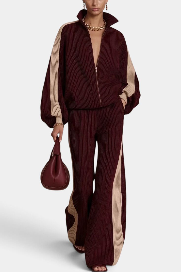Mahaute Radostina burgundy and beige ribbed knit zip-up jacket and wide-leg trousers set with contrast side stripes.