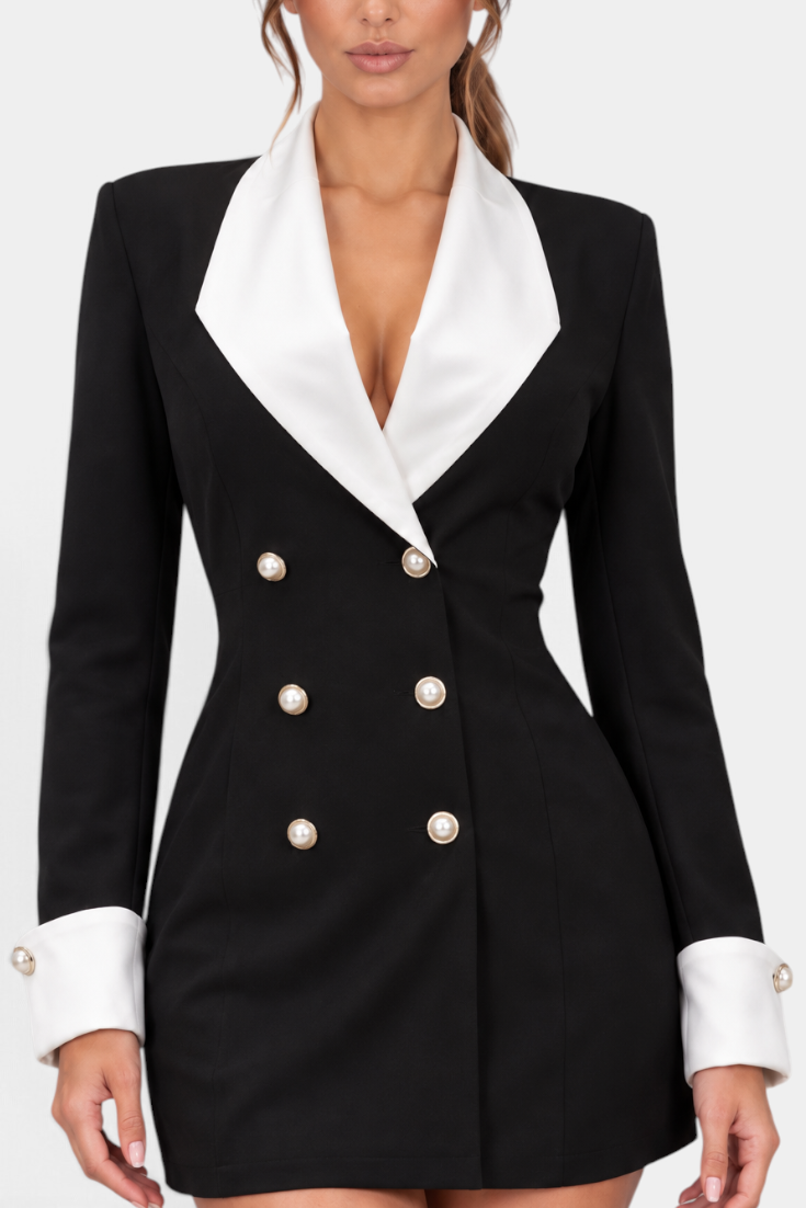 Mahaute Rebecca short black blazer dress with white contrast lapels, cuffs, and decorative pearl buttons.