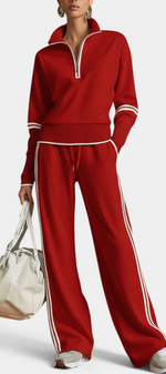 Mahaute red knit lounge set with zip-up collar, ribbed cuffs, and white contrast side stripes on pants and sleeves.