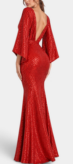 Mahaute red sequin evening gown with flared sleeves and a deep open back, worn by a model in a formal setting.