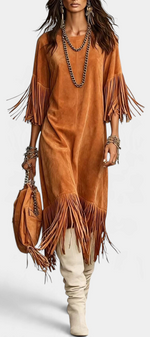 Mahaute Rozenn tan faux suede midi dress with fringe sleeves and hem, styled with tall boots and layered necklaces.