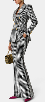 Mahaute Rumyana houndstooth double-breasted blazer and flared trousers suit with gold buttons on a model
