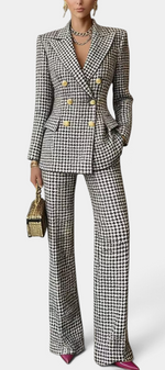 Mahaute Rumyana houndstooth double-breasted blazer and flared trousers suit with gold buttons on a model
