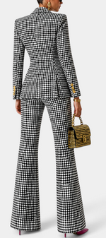 Mahaute Rumyana houndstooth tailored suit with double-breasted blazer and flared trousers, back view