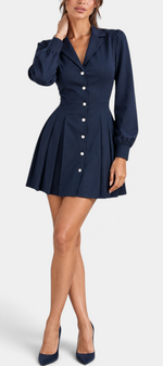 Mahaute Ruzha navy blue short shirt dress with a cinched waist, button-front, and pleated skirt on a model