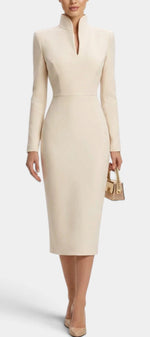 Mahaute Sandy beige midi dress with long sleeves, fitted waist, and a modern split mock neck on a model