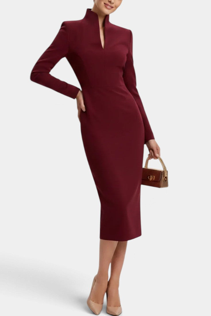 Mahaute Sandy burgundy midi dress with a high split neckline and long sleeves worn by a model with nude heels.