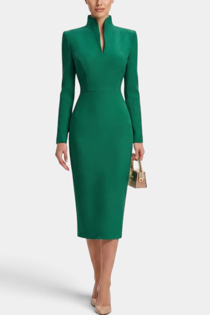 Mahaute Sandy emerald green midi dress with a high split collar and long sleeves on a model wearing nude heels.