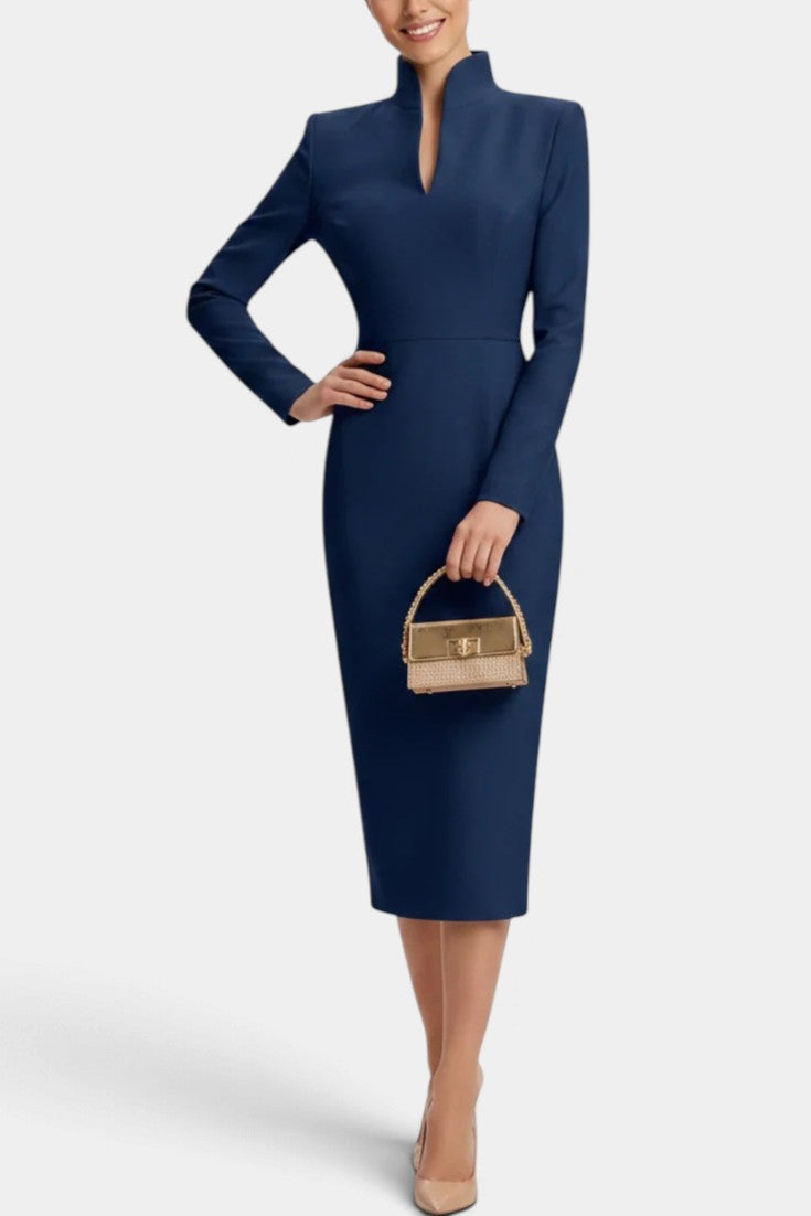 Mahaute Sandy navy blue midi dress with long sleeves, high split neckline, and fitted silhouette on a model