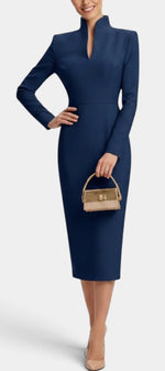 Mahaute Sandy navy blue midi dress with long sleeves, high split neckline, and fitted silhouette on a model