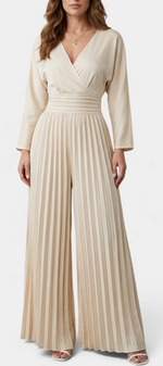 Mahaute Seam beige pleated wide-leg jumpsuit with a V-neck wrap bodice and high waist, worn by a model.