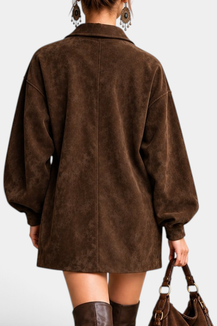 Back view of Mahaute Sestina short brown faux suede dress with balloon sleeves and a matching handbag