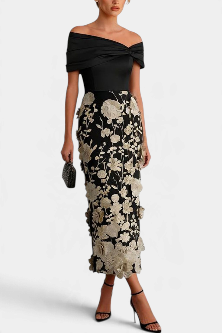 Mahaute Shay long black off-shoulder dress with floral embroidery and 3D textured details for formal occasions.