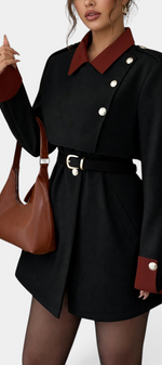 Mahaute short black coat with contrasting burgundy collar, cuffs, belted waist, and gold buttons.