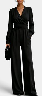 Mahaute Sophronia black long-sleeve jumpsuit featuring a wrap V-neck, draped waist, and elegant wide-leg trousers.
