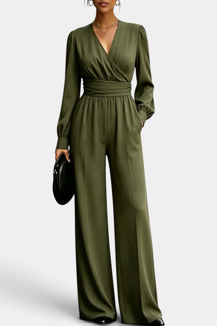 Mahaute Sophronia olive green long-sleeve jumpsuit with a wrap V-neck, draped waist, and wide-leg trousers.