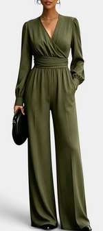 Mahaute Sophronia olive green long-sleeve jumpsuit with a wrap V-neck, draped waist, and wide-leg trousers.